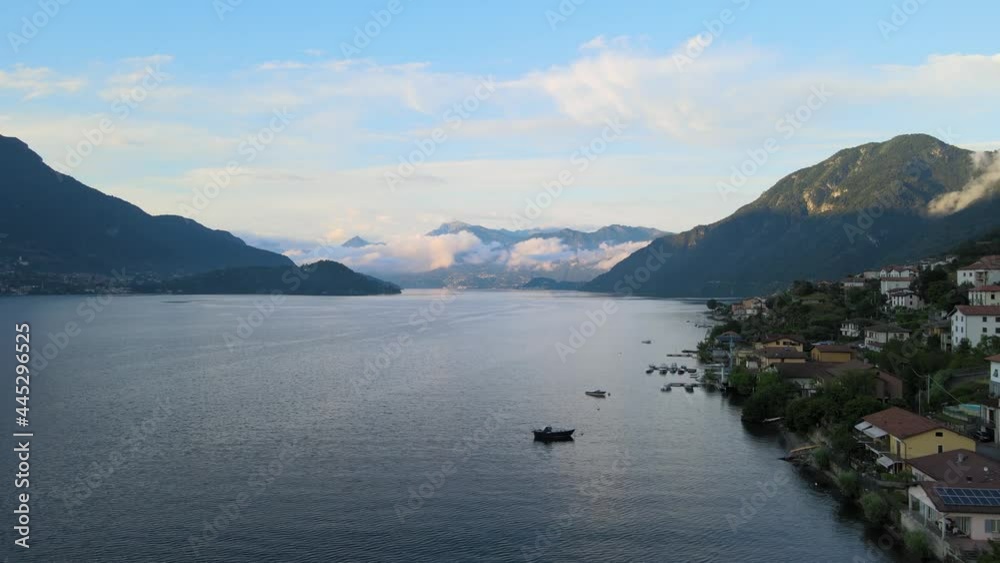 beautiful areal panorama of the com lake in the middle of Italy in the alps while sunset.