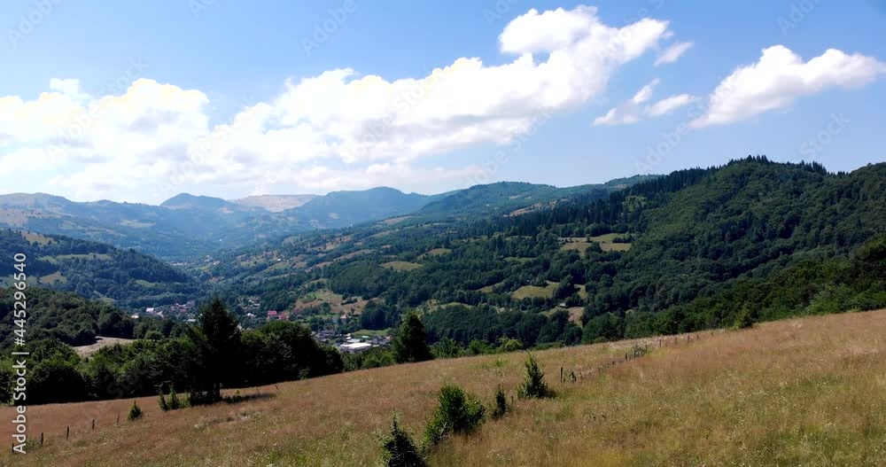 Revealing Shot Of Tranquil Village From Apuseni Mountain In Romania. aerial drone Revealing Shot Of Tranquil Village From Apuseni Mountain In Romania. aerial drone