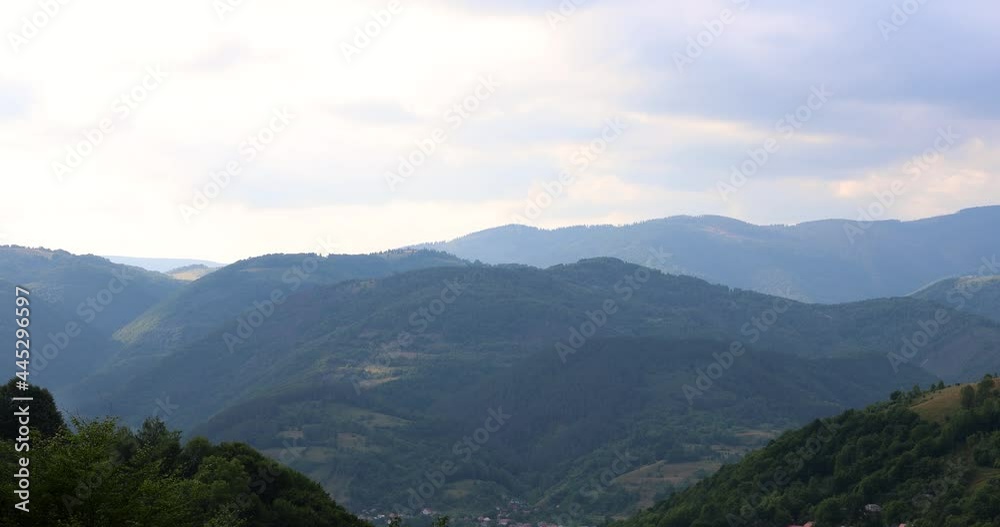 Beautiful Scenery of Green Mountain Range Under Cloudy Sky. static shot Beautiful Scenery of Green Mountain Range Under Cloudy Sky. static shot