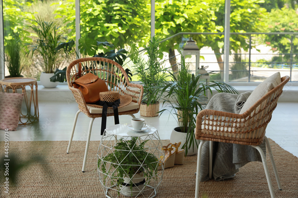 Indoor terrace interior with elegant furniture and houseplants - obrazy, fototapety, plakaty 
