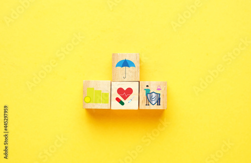 Wooden block with insurance concept. Wealth, medical and future protection