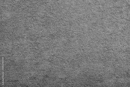 Grey microfiber cloth as background, top view