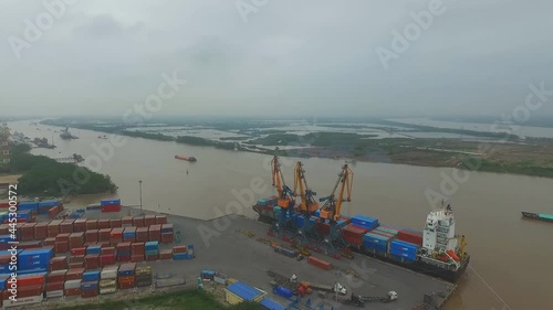 Cargo ships in a port of Hai Phong, Vietnam. Hai Phong port is one of the two biggest ports in Vietnam. (aerial photography) photo