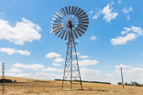 Old metallic wind pump or water pumping windmill Western Australia