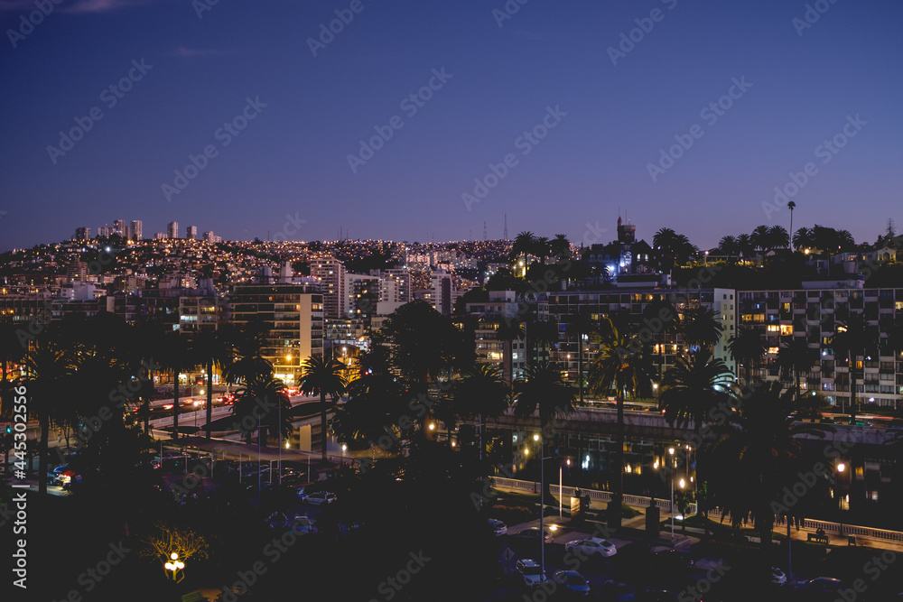 Night view of the skyline of the hills of Valparaiso and Viña del Mar with beautiful lights and Marga Marga river, Chile