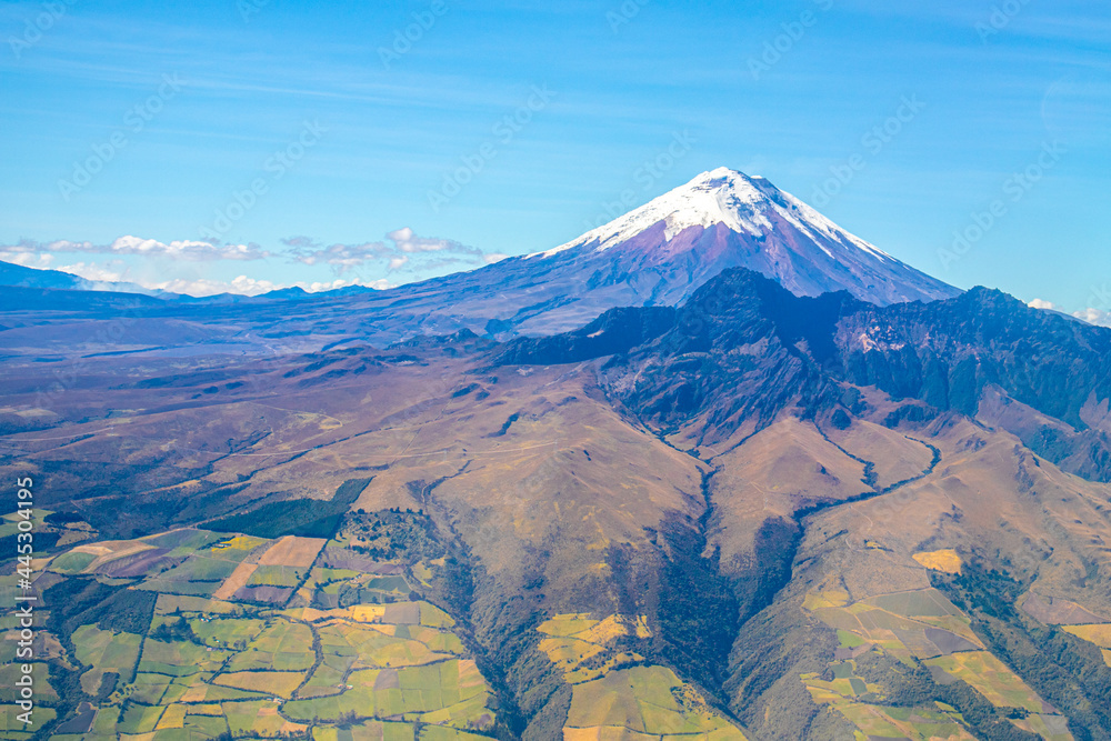 Cotopaxi volcano seen from the air on a summer morning. Clear and blue sky.