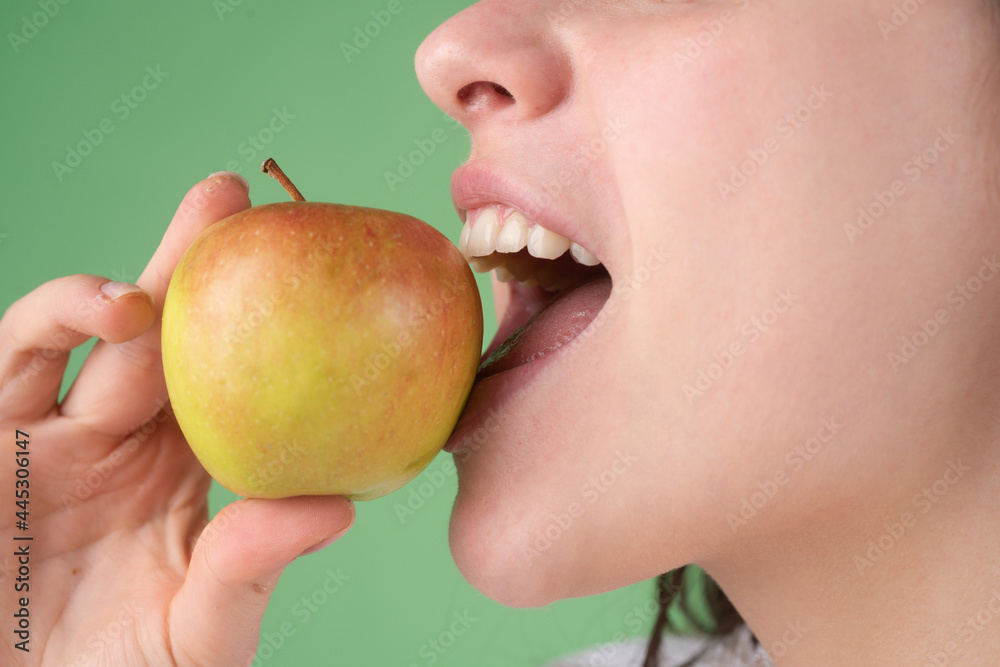 Female biting an apple. Open mouth woman about to bite green apple. Female biting an apple. Open mouth woman about to bite green apple.