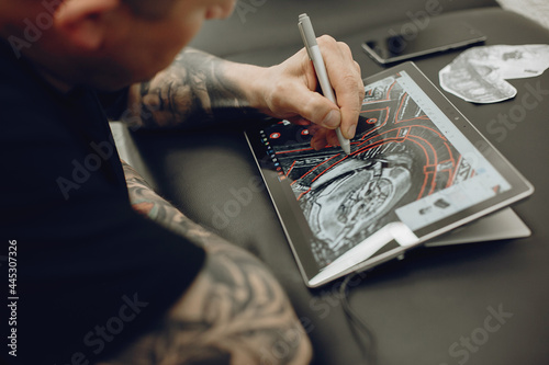 Man drawing the sketch in a tablet