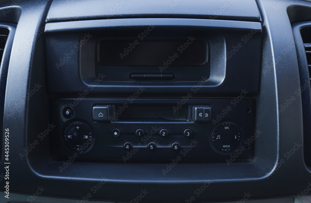 Modern radio on dashboard of car, closeup