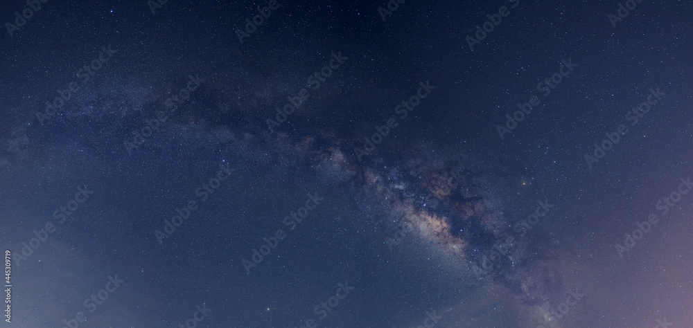 Panorama blue night sky milky way and star on dark background. Universe filled with stars, nebula and galaxy with noise and grain.Photo by long exposure and select white balance.selection focus.amazin