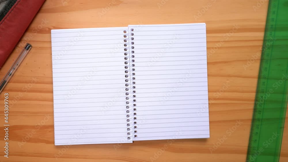 Hands Open Notebook With Empty Pages On The Table. top view Hands Open Notebook With Empty Pages On The Table. top view