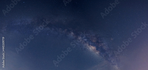 Panorama blue night sky milky way and star on dark background. Universe filled with stars, nebula and galaxy with noise and grain.Photo by long exposure and select white balance.selection focus.amazin