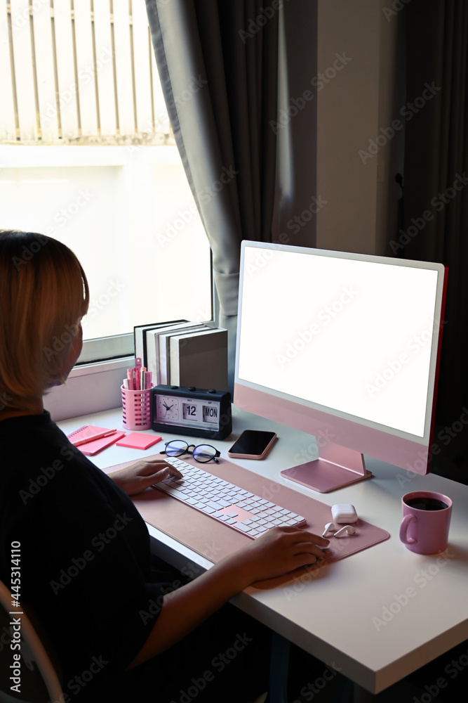 Side view creative woman working with computer in modern office. Side view creative woman working with computer in modern office.