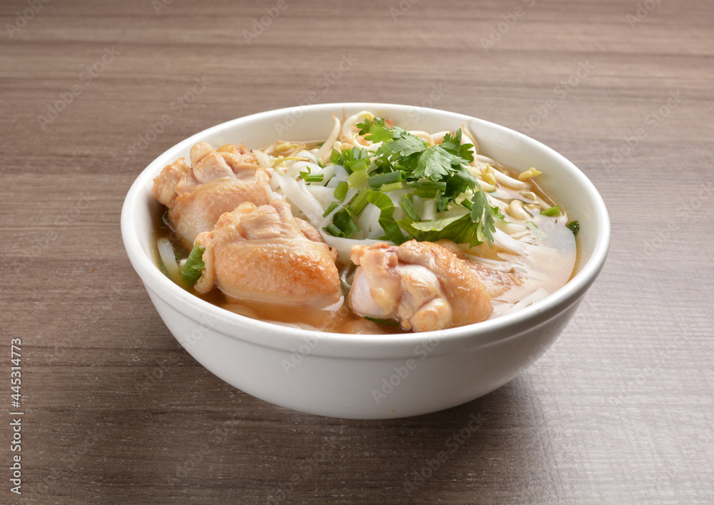 cook clear hot soup with chicken meat, vegetable and noodle on wood background asian halal menu cook clear hot soup with chicken meat, vegetable and noodle on wood background asian halal menu