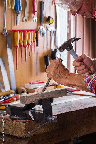 Carpenter working on the work bench, joinery tools and woodwork