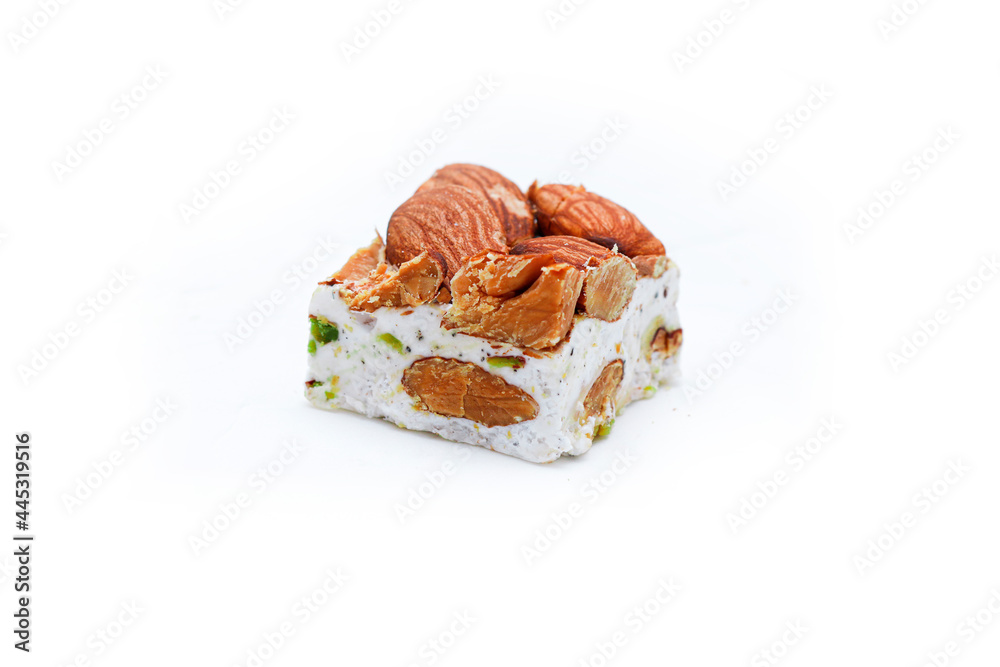 Homemade nougat bars with almonds and dried fruits isolated on white Homemade nougat bars with almonds and dried fruits isolated on white