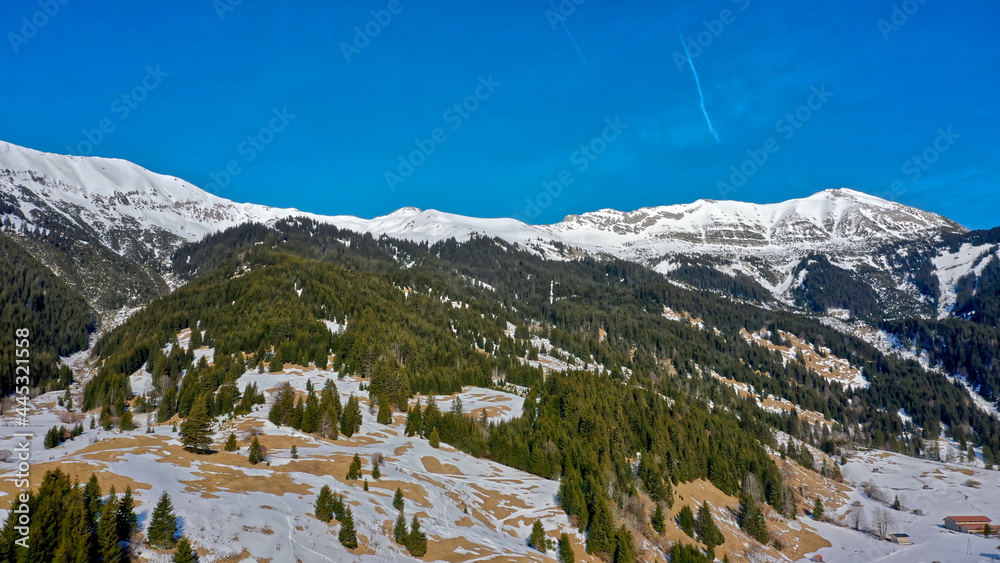 Blue sky over the snowy peaks of mountains in winter