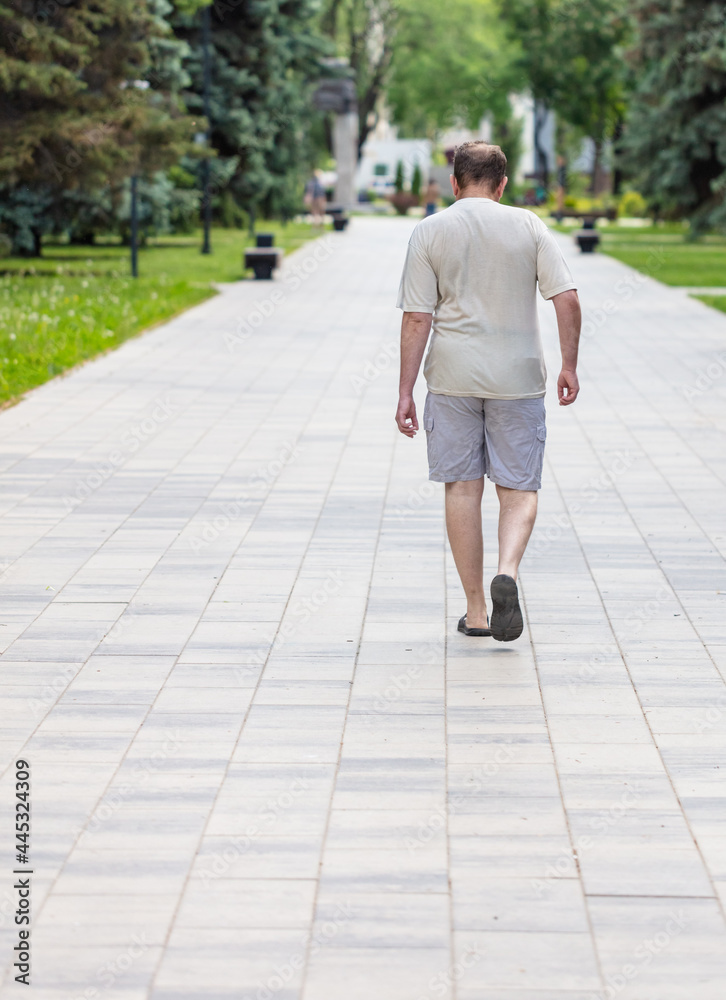 A man in shorts walks A man in shorts walks