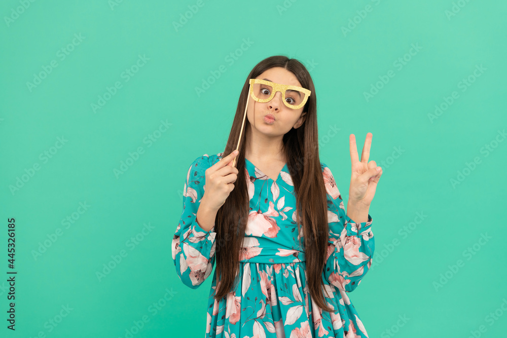 Stay cool. Cool girl hold booth glasses showing victory hand. Enjoying disguise party Stay cool. Cool girl hold booth glasses showing victory hand. Enjoying disguise party