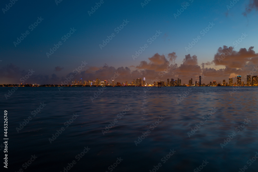 Naklejka premium Miami at sunset. Miami Florida, colorful skyline of Macarthur causeway.