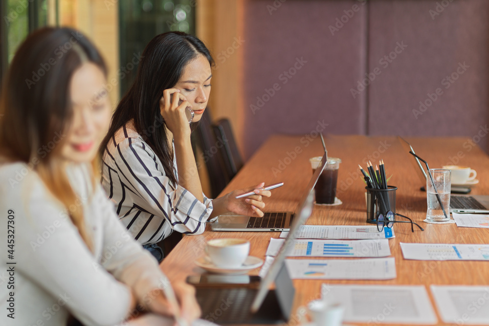 Accountant contact with business client on mobile phone in the office room Accountant contact with business client on mobile phone in the office room