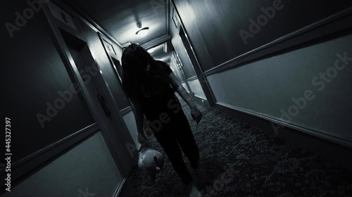 Eerie Horror Scene of a Possessed Girl In A Hotel Corridor photo