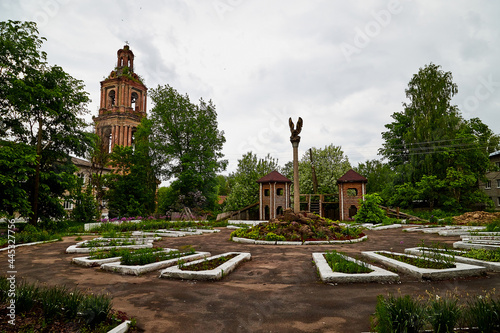 The bell tower of the Orthodox church, made of red bricks photo