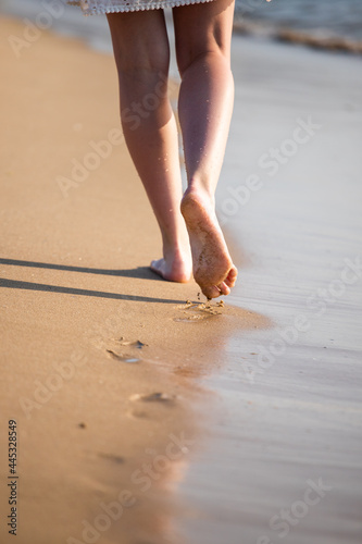 feet on the beach, person walking on the beach