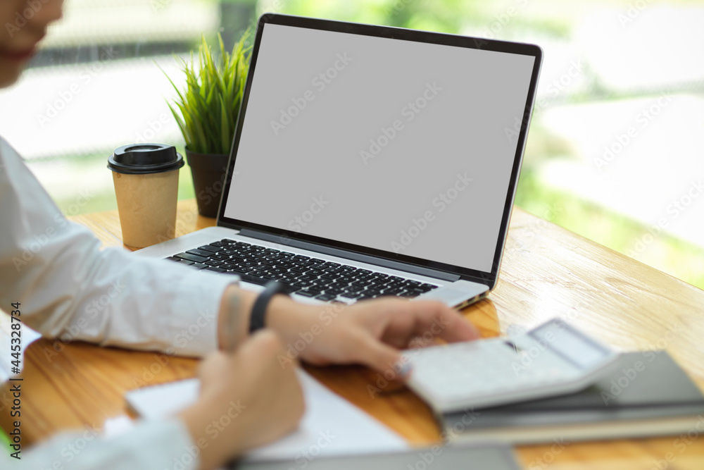 Laptop screen mock up, laptop in blank empty screen on the desk while female working Laptop screen mock up, laptop in blank empty screen on the desk while female working