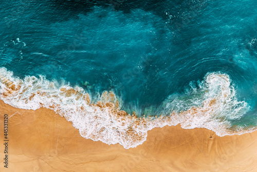 Relaxing aerial beach scene, summer vacation holiday template banner. Waves surf with amazing blue ocean lagoon, sea shore, coastline. Perfect aerial drone top view. Peaceful bright beach, seaside