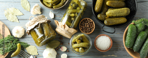 Concept of cooking pickles on gray wooden table photo