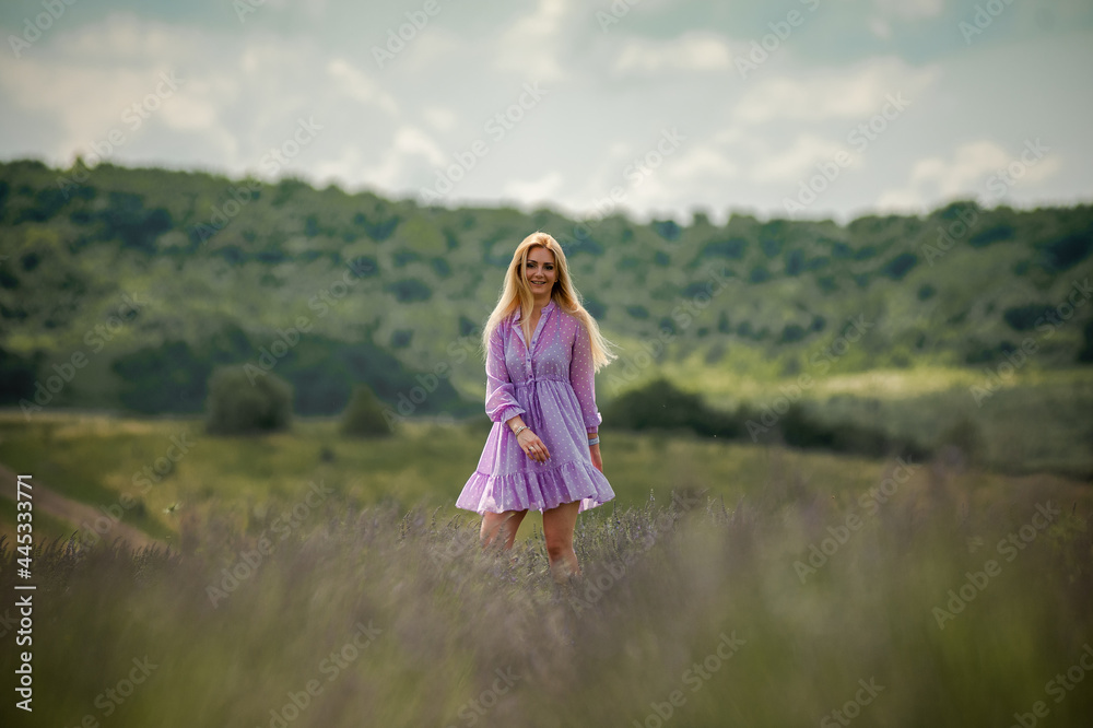 Portrait of smiling blonde woman on the lavender field Portrait of smiling blonde woman on the lavender field