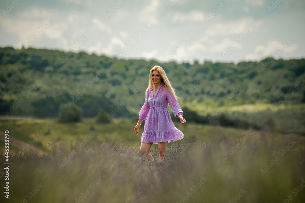 Portrait of smiling blonde woman on the lavender field Portrait of smiling blonde woman on the lavender field