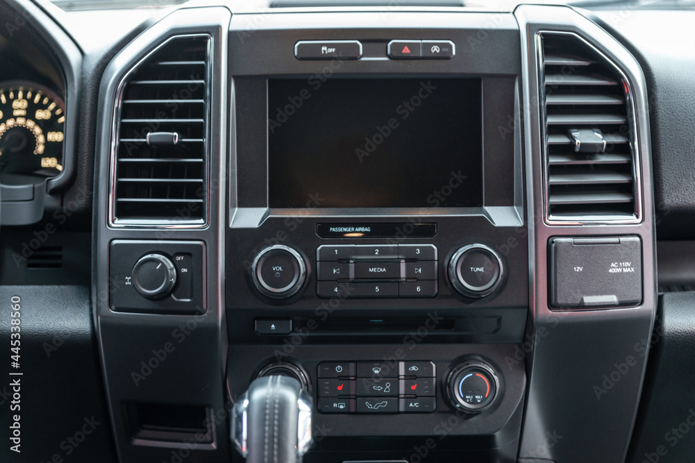 Modern car interior with multimedia display and dashboard. View from inside a car Modern car interior with multimedia display and dashboard. View from inside a car