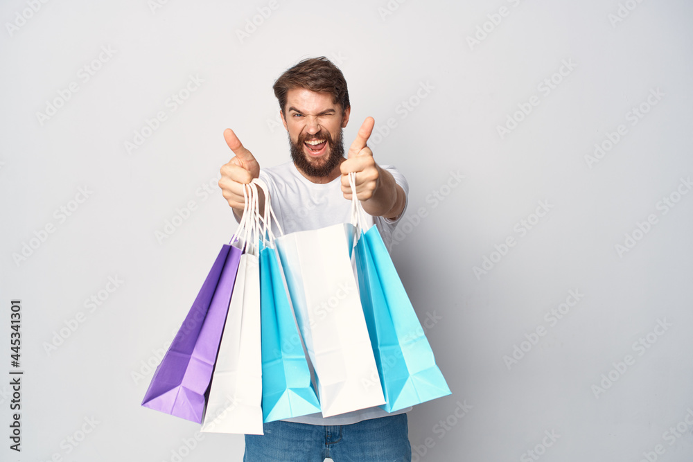 man with packages in his hands fashion shopping discounts emotions man with packages in his hands fashion shopping discounts emotions