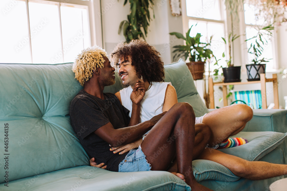 Beautiful gay couple being romantic indoors - obrazy, fototapety, plakaty 