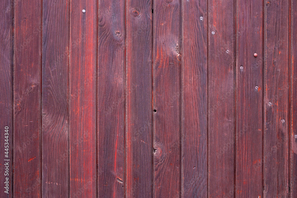 The old red wood texture with natural patterns The old red wood texture with natural patterns