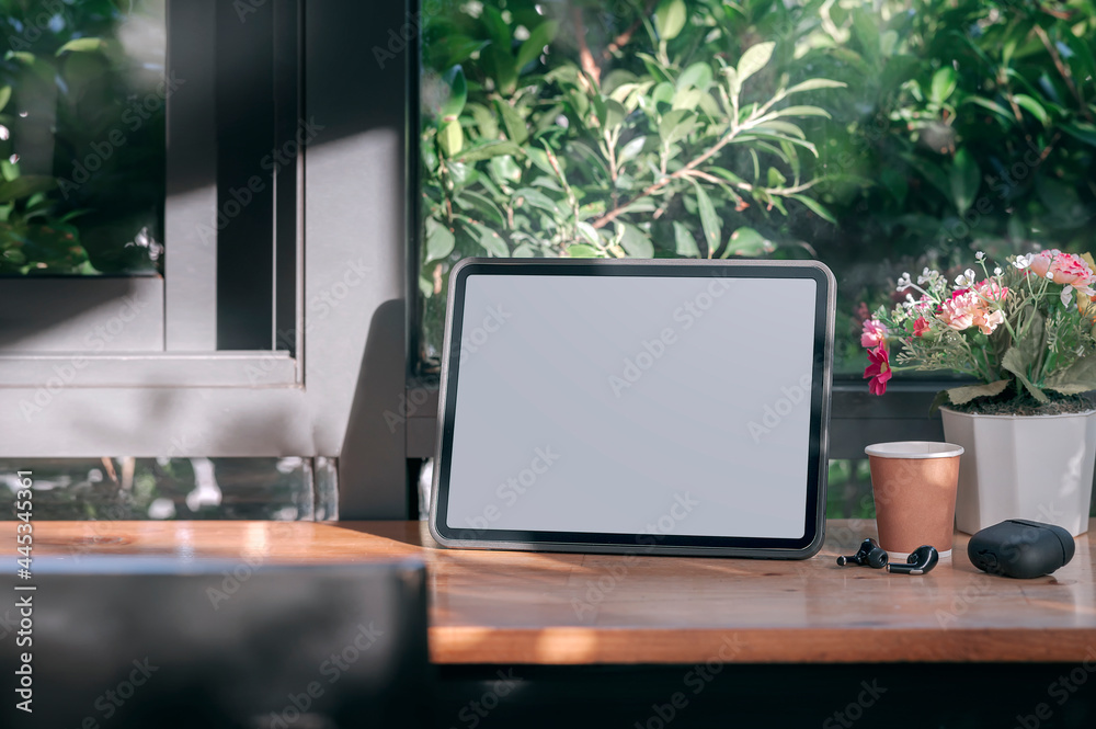 Mockup blank tablet on wooden counter table in cafe. Mockup blank tablet on wooden counter table in cafe.