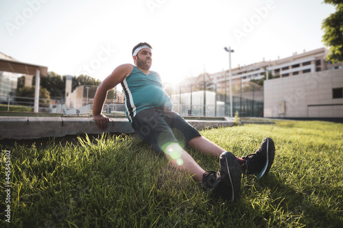 a young man exercising in an outdoor park.
willpower. photo