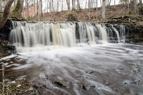 Long exposure waterfall on small river Ivande in Renda, Latvia.