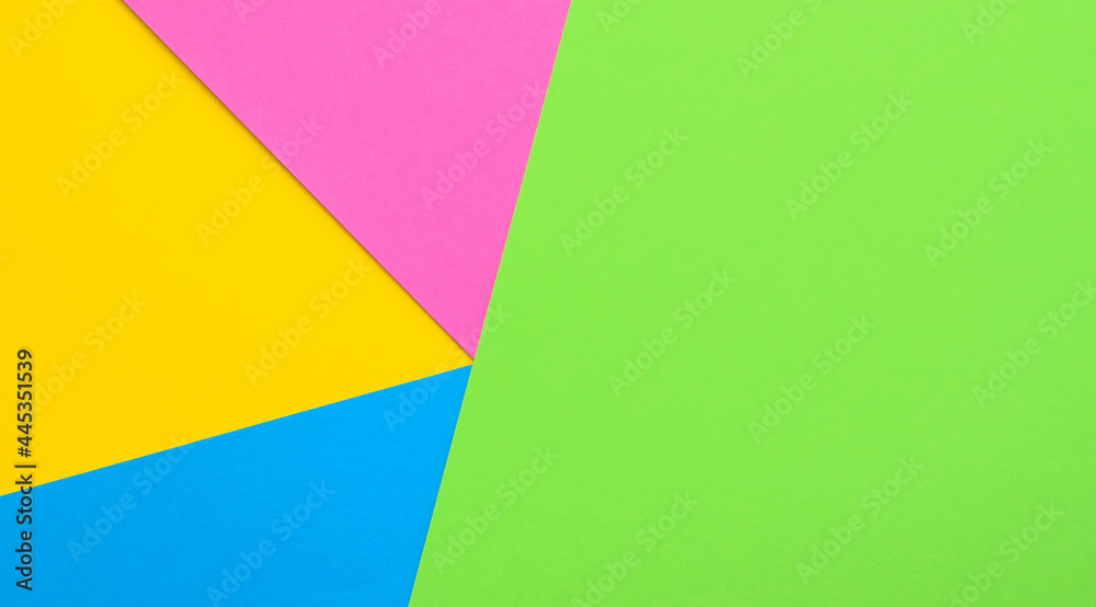 Multicolored paper geometric background. Colored paper pattern.