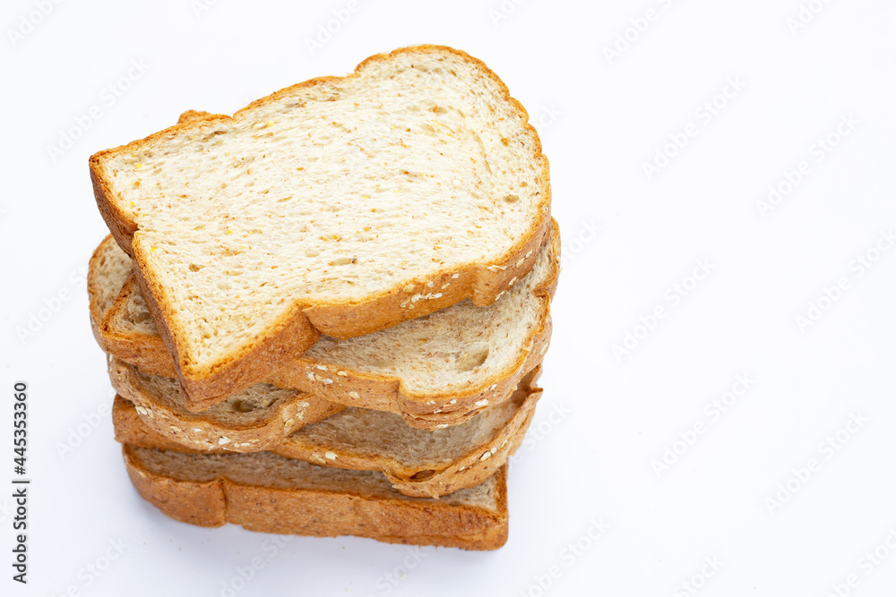 Stack of sliced wholegrain bread on white