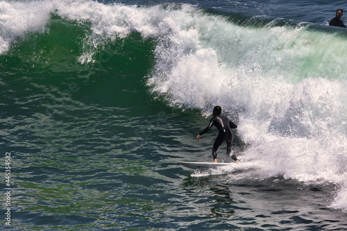 Surfing big summer waves at Point Dume California