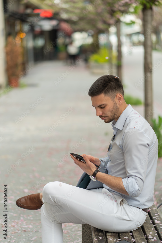 Fototapeta premium Checking his phone