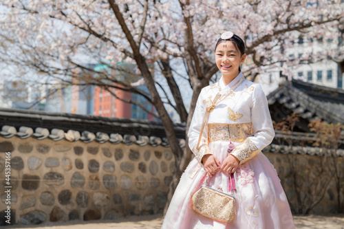 Korean lady in hanbok dress costume smile in an ancient Gyeongbokgung palace in Seoul city © anekoho