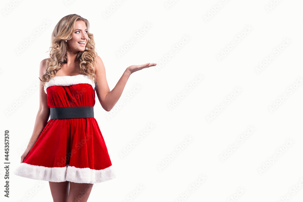 Young beautiful Santa girl in Short festive dress fur, Long blonde hair, Bright make up, Conceptual fashion art. Young beautiful Santa girl in Short festive dress fur, Long blonde hair, Bright make up, Conceptual fashion art.