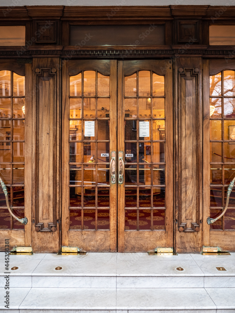 Theatre Doors, London. The ornate wooden doors to the main entrance of a traditional old West End theatre. Theatre Doors, London. The ornate wooden doors to the main entrance of a traditional old West End theatre.