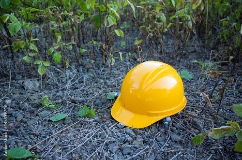 yellow work helmet on the ground surrounded by grasses in nagano pref, japan