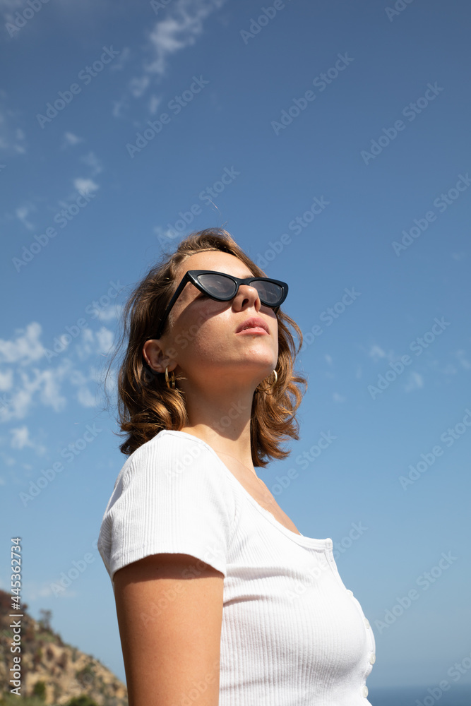 Natural beauty of as young lady in her vacation time enjoying her holidays in a beach of the coast side in a tourist location. 