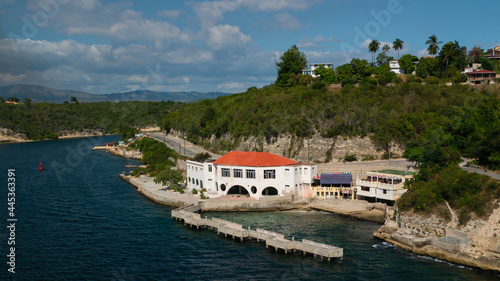Beautiful building on the entrance to the bay of Santiago de Cuba with berth